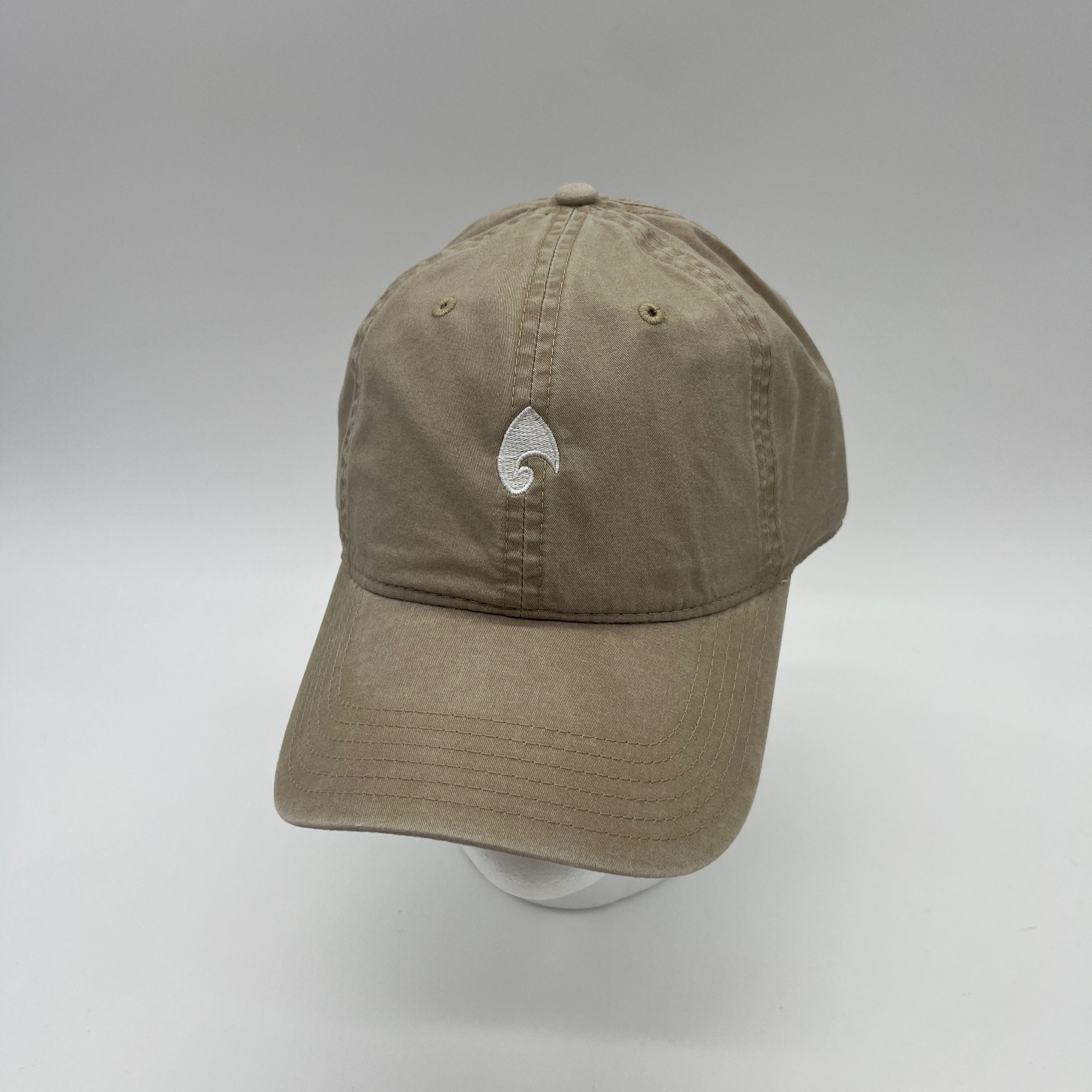KONO embroidered logo dad hat in khaki—unstructured cotton baseball cap with curved brim, adjustable back, studio shot.