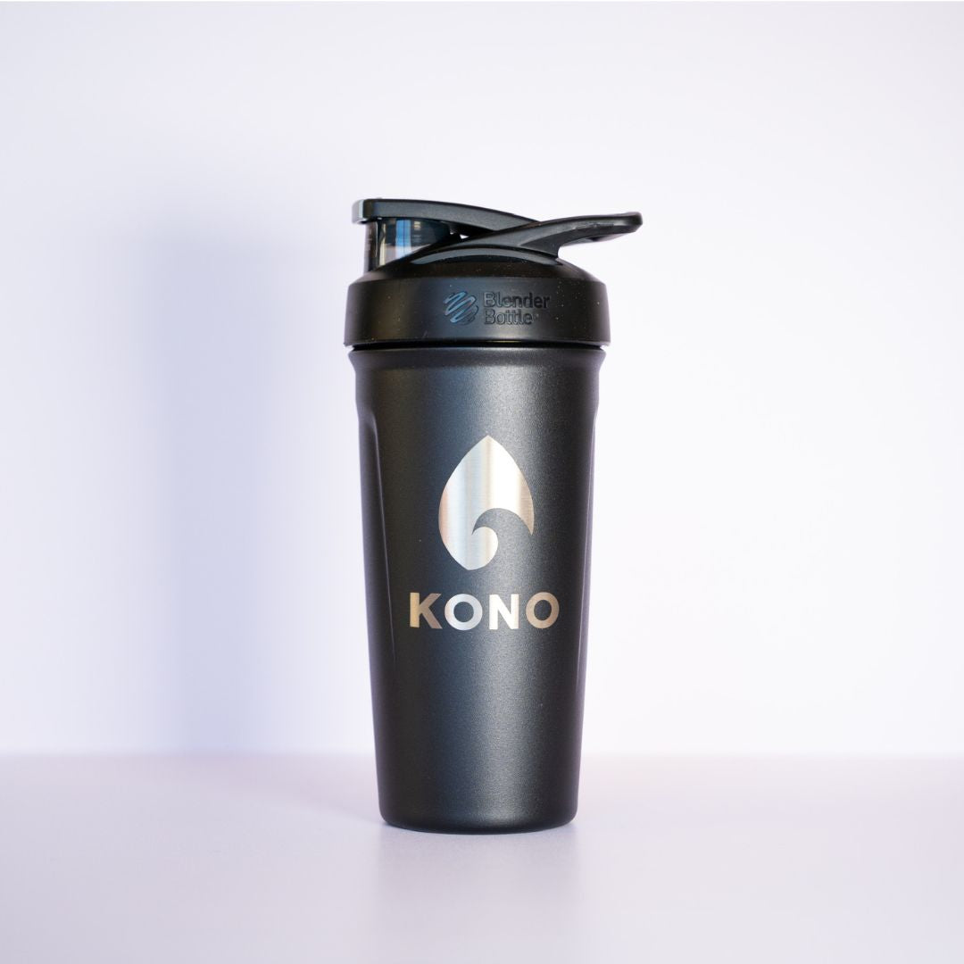 Black shaker: Matte black KONO BlenderBottle shaker bottle with flip cap and metallic logo, front-facing studio product image.
